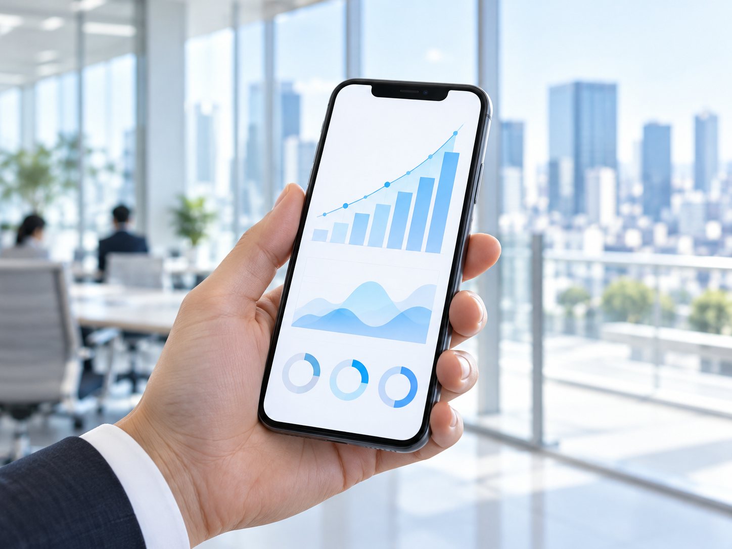 成長を示すグラフが表示されたスマートフォン